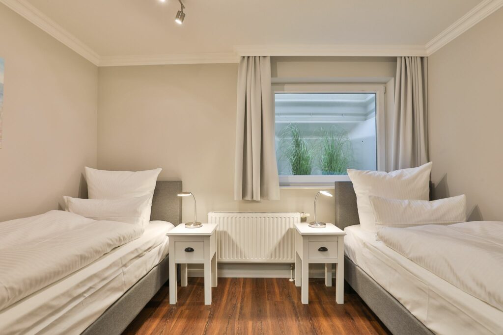 Schlafzimmer mit Einzelbetten in Ferienwohnung Hörnum