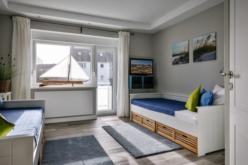 Schlafzimmer mit Einzelbetten in Ferienwohnung Hörnum