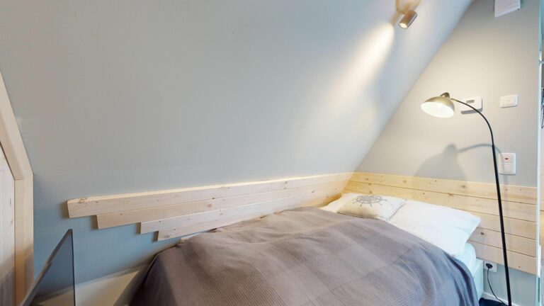 Schlafzimmer mit Doppelbett in Ferienwohnung Hörnum