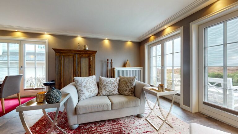 Wohnzimmer mit Zugang zur Terrasse in Ferienwohnung Hörnum