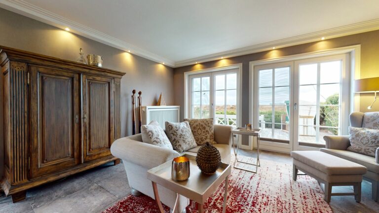 Wohnzimmer mit Sofa in Ferienwohnung Hörnum