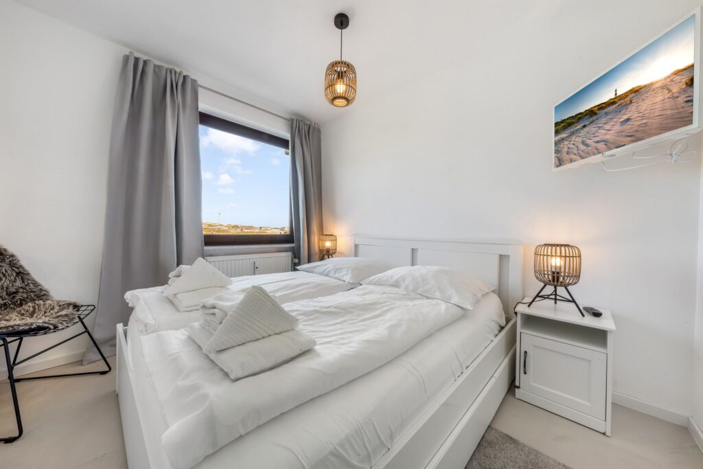 Schlafzimmer einer Ferienwohnung auf Sylt
